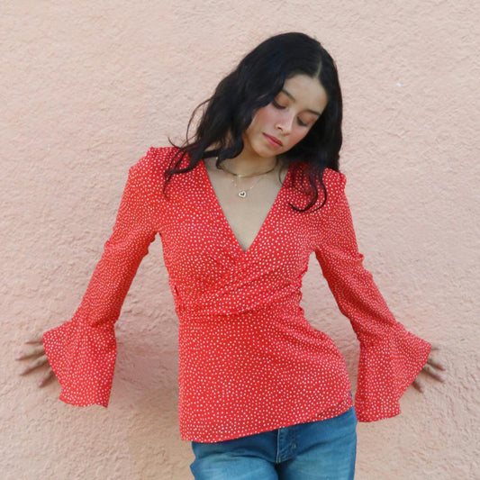 Red Polka dot top with flare sleeves.